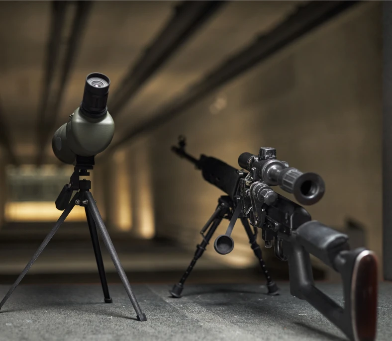 Precision shooting gear in dimly lit range